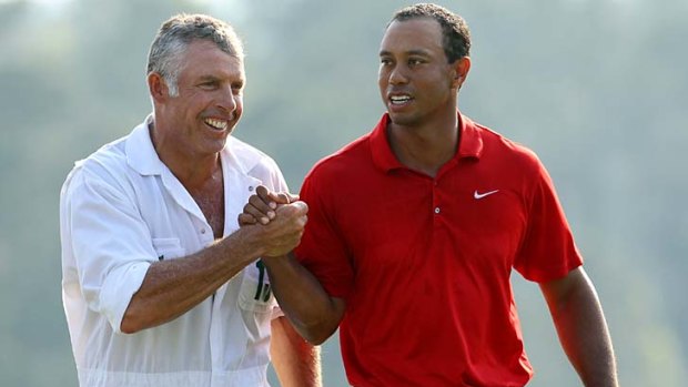 Happier times ... Tiger Woods walks off the 18th green with his caddie Steve Williams after the final round of this year's US Masters.