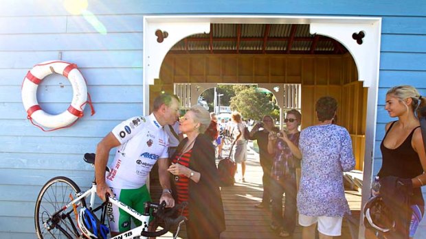 Off your bike... Bronwyn Bishop greets Tony Abbott at Palm Beach jetty as his daughter Frances right, waits to join him for his final leg to Manly.