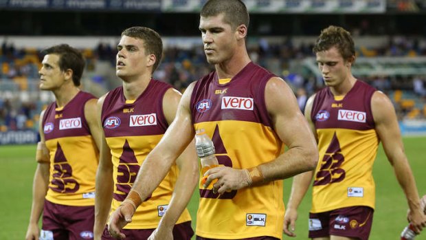 Jonathan Brown of the Lions leads the team off after losing the round eight AFL match between the Brisbane Lions and the Essendon Bombers at The Gabba on May 10, 2014 in Brisbane, Australia.  (Photo by Chris Hyde/Getty Images)