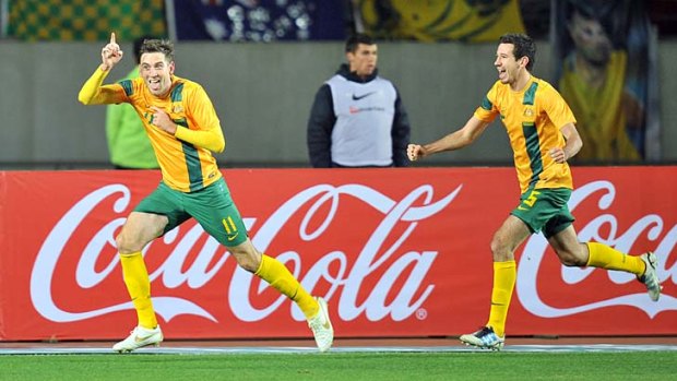Happy days ... Australia's defender Robert Cornthwaite wheels away to celebrate his goal.