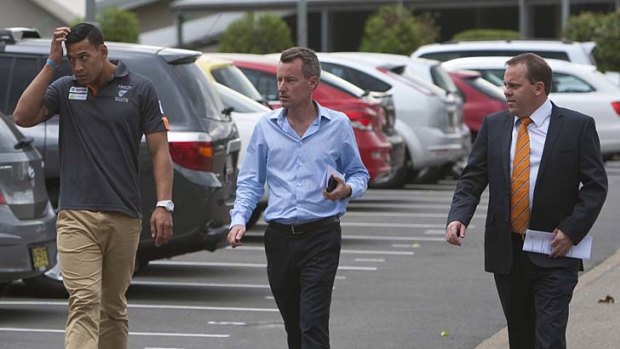 Israel Folau, David Matthews and Nick Johnston arrive for the GWS media conference yesterday.