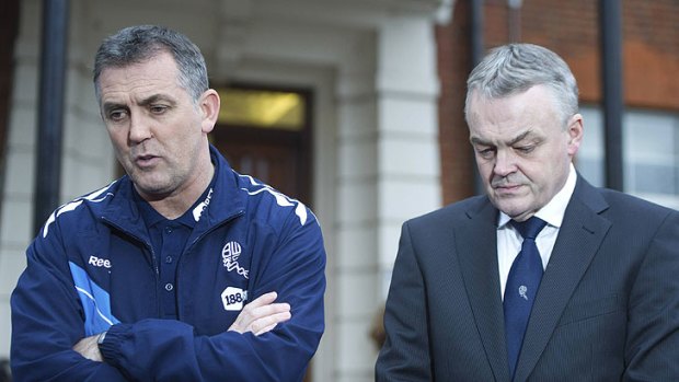 Tense wait ... Bolton Wanderers manager Owen Coyle, left, and chairman Phil Gartside speak to the media outside the London Chest Hospital, where Muamba remains gravely ill.