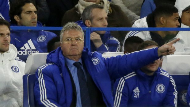 Chelsea's manager until the end of the season Guus Hiddink points during the English Premier League soccer match between Chelsea and Watford at Stamford Bridge stadium in London, Saturday, Dec. 26, 2015.  (AP Photo/Matt Dunham)
