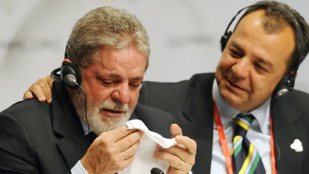 Teary-eyed Brazilian President Luiz Inacio Lula da Silva and Governor of the State of Rio de Janeiro Sergio Cabral at a press conference.
