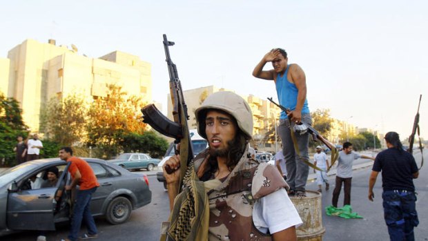 The fight goes on ... Libyan rebels in Tripoli.