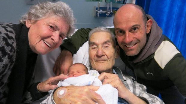 Peter Papathanasiou and his parents with his newborn son.