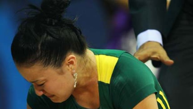 Erika Yamasaki of Australia is in tears after injuring her elbow.