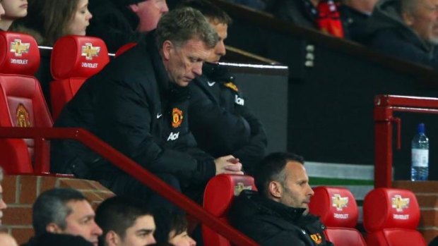 Hard to watch: David Moyes during United's 3-0 loss to City.