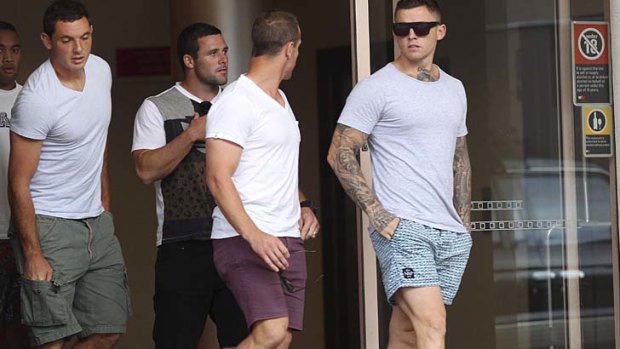 Crisis meeting:  (from left) Ricky Leutele, Johnathan Wright, Michael Gordon, Jeff Robson and Todd Carney leave a gathering of Sharks players at the Rydges Hotel in Cronulla yesterday.