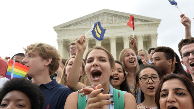 Gay marriage supporters celebrate outside the US Supreme Court in Washington, D.C. on Friday.