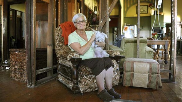 Gail Smyth and her dog, Fleur, at her Charlton home, from which the internal walls  had to be removed when mould was found to be growing in them.