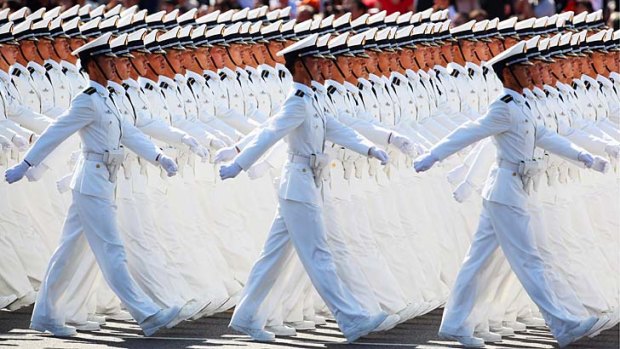 Emerging superpower: Sailors march in Tiananmen Square.