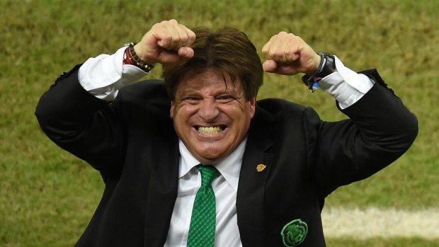 Emotional ... Mexico's coach Miguel Herrera celebrates after the victory over Croatia in Group A. 