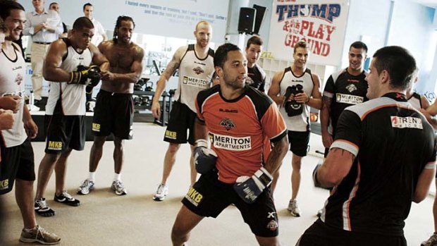 Fighting back . . . Benji Marshall dons the gloves with his fellow Tigers during a boxing training session on Friday. Hours later the Wests Tigers superstar was involved in a fight in Sydney's city centre.