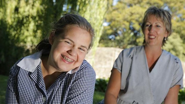 Schoolgirl Emily Blake, pictured with her mother Susan, suffered brain damage in a bus crash, inspiring the safety push.