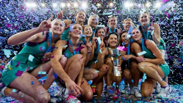 Winning formula: The Melbourne Vixens celebrate with their championship trophy.