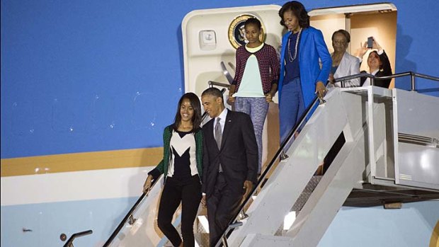 Son of Africa: Barack and Michelle Obama and daughters Malia and Sasha arrive in South Africa.