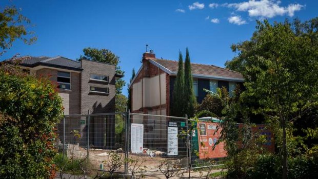 Owner of one half of a classic Canberra duplex is angry about their neighbour demolishing the other half in Fraser Place, Yarralumla.