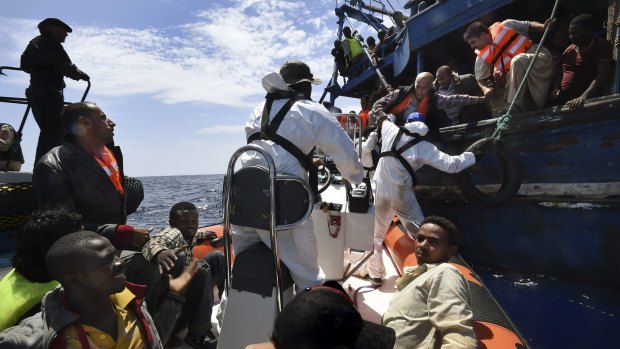 Refugees on a wooden boat carrying 565 people are rescued off the Libyan coast by Migrant Offshore Aid Station crew.
