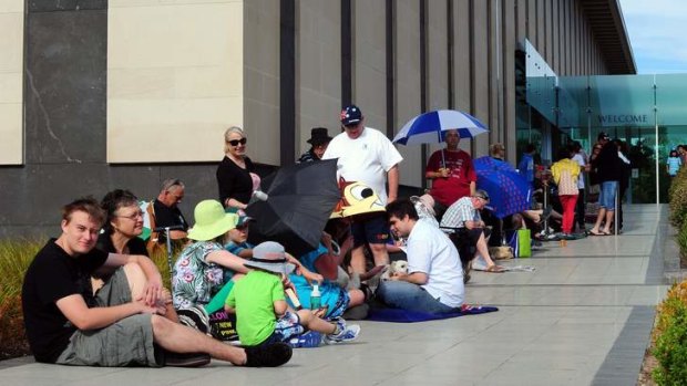 People queue at the National Mint of Australia on Tuesday to get the first coins of 2013.