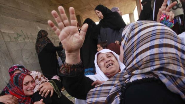Relatives of a 12-year-old boy killed during Israeli air raids on the northern Gaza Strip.