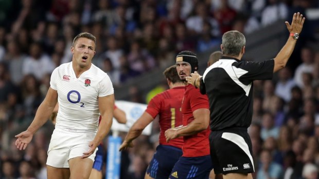 Letter of the law: Sam Burgess is penalised during his England debut against France.