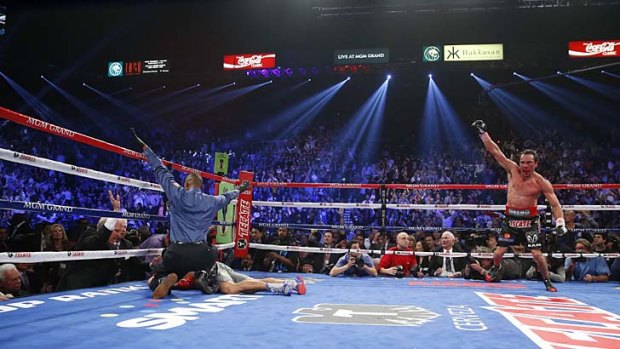 It's a knockout ... Juan Manuel Marquez celebrates after putting an end to his fight with Manny Pacquiao.