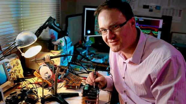 Jonathan Oxer working on his micro satellite prototype.