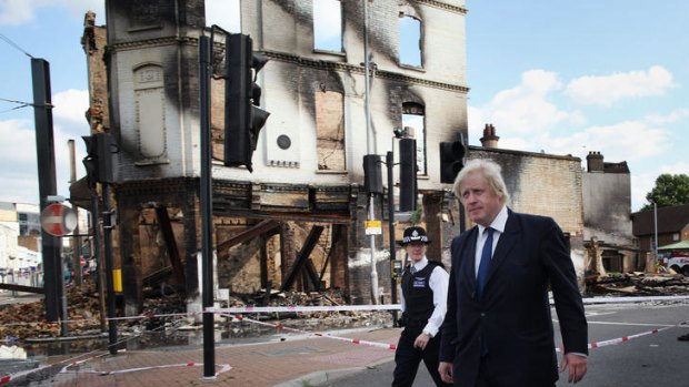 Mayor Boris Johnson walks through riot-hit Croydon.