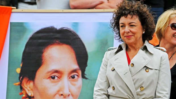 Therese Rein with a poster of Aung San Suu Kyi.