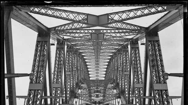 The road and underside of the arch of Sydney Harbour Bridge, from about 1932.