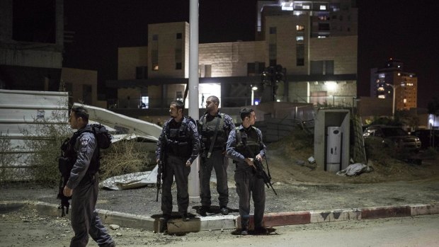 Israeli police stand guard in Kiryat Gat after the attack in which four people were stabbed.