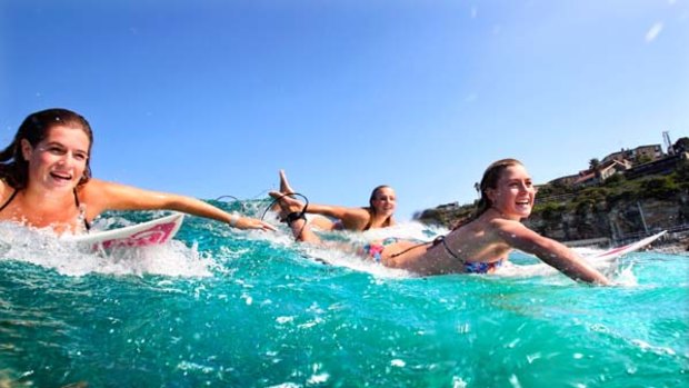 Courage and perseverance ... the stars of <i>First Love</i>, Jess Laing, India Payne and Nikki Van Dijk on action at Bronte beach.