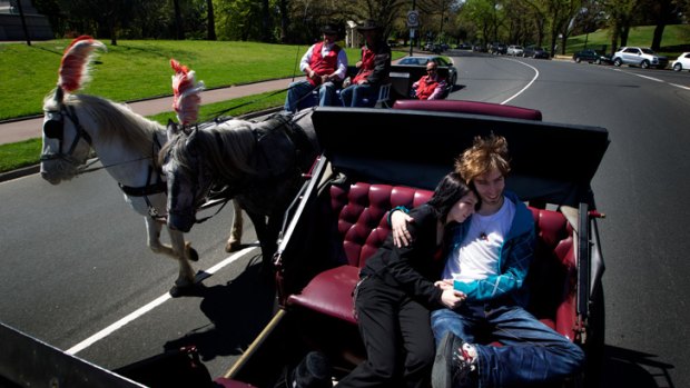 Along for the ride: Bec Nicholson and Matthew Ewert in one of Melbourne’s horse-drawn carriages.