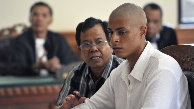 Allegedly used fruit bowl to kill girlfriend's mother ... Tommy Schaefer listens to an interpreter in a court in Denpasar, Bali as he faces the premeditated murder charge.
 