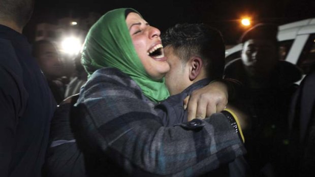 Released &#8230; a Palestinian hugs her freed son.