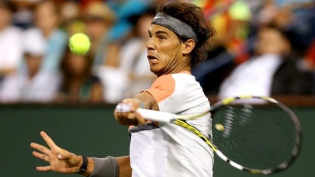 Upset: Rafael Nadal plays a forehand in his shock loss to Alexandr Dolgopolov at Indian Wells.