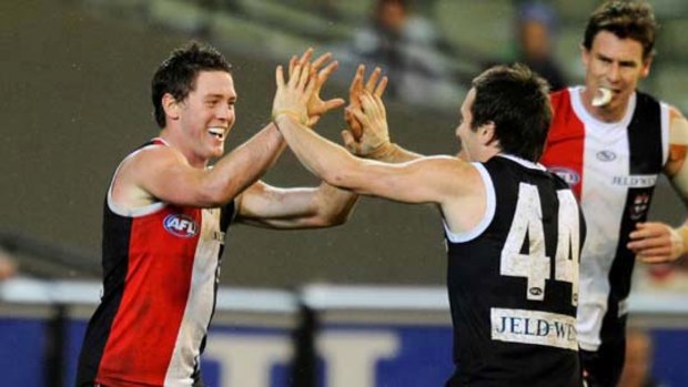 Jack Steven (left) is congratulated by Stephen Milne after one of his third-quarter goals.