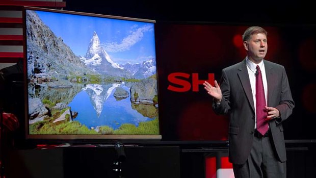 Sharp's Jim Sanduski shows off an ultrahigh-definition TV.