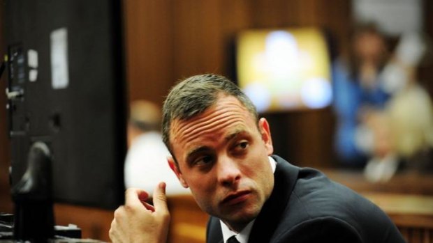Selling his Pretoria home ... South African Paralympic athlete Oscar Pistorius sits in the docks during his trial for the murder of his girlfriend Reeva Steenkamp.