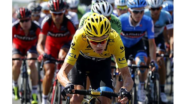 Under attack: Yellow jersey holder Chris Froome in the peloton: ''I'm just happy I still have an advantage of two minutes.''