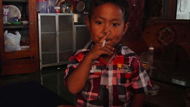 ''It's like he's possessed, he really wants it'' &#8230; four-year-old Muhammad Dihan Awalidan, who smokes 25 cigarettes a day.
