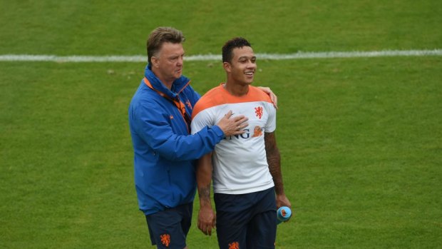 Brilliant manager ... Netherlands' coach Louis van Gaal (left) shares a light moment with forward Memphis Depay at training.