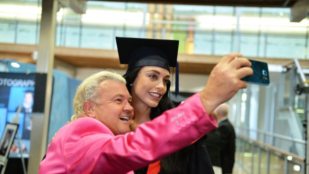 Geelong mayor Darryn Lyons with fiance Elissa Friday as she graduates from a journalism course at Deakin University on Wednesday. 