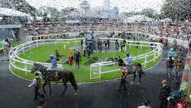 Rain on the parade: Under cover was the place to be as the weather worked against the first day of The Championships.