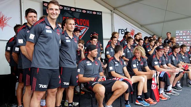 Jobe Watson (extreme left) with other Essendon players at Monday's family day.