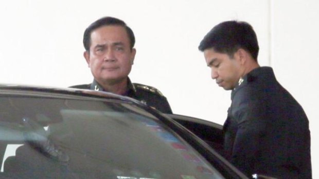 In charge: army chief and self-declared prime minister Prayuth Chan-ocha leaves Bangkok's Army Club shortly before he announced his coup on Thursday.