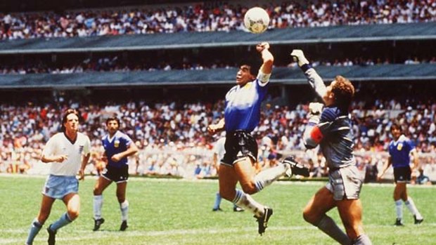 Hand of God ... Diego Maradona scores against England in the 1986 World Cup.