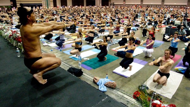 Bikram Choudhury, front at the Yoga Expo 2003, leads a yoga class at the Expo at the Los Angeles Convention Centre.