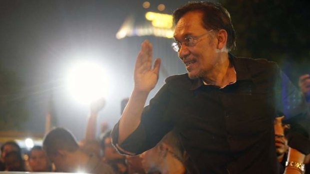 Fired up: Opposition Leader Anwar Ibrahim leaves the rally outside Kuala Lumpur on Saturday.